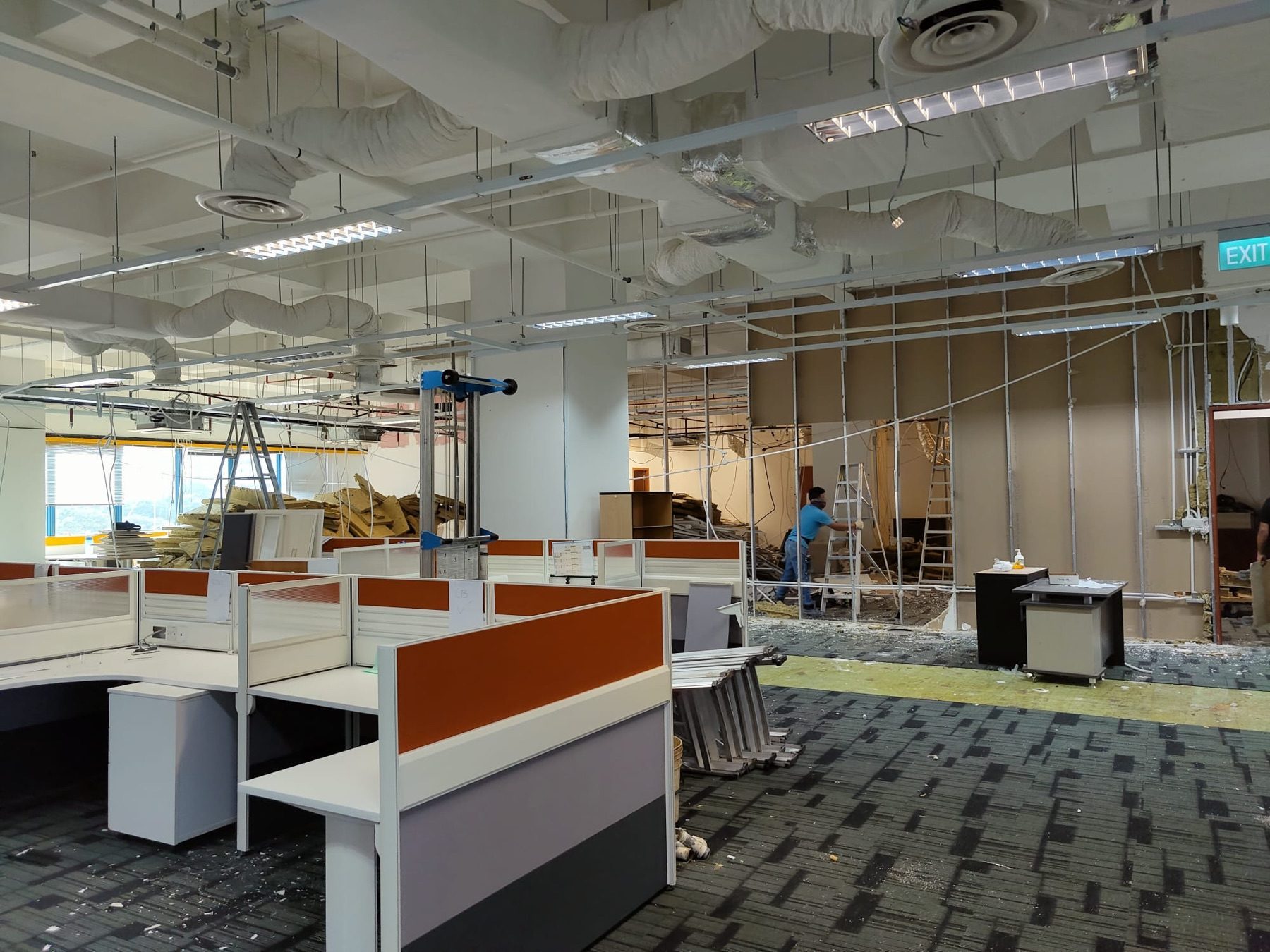 Before: old workstations, partitions and ceiling services still in place, Haw Par Technocentre