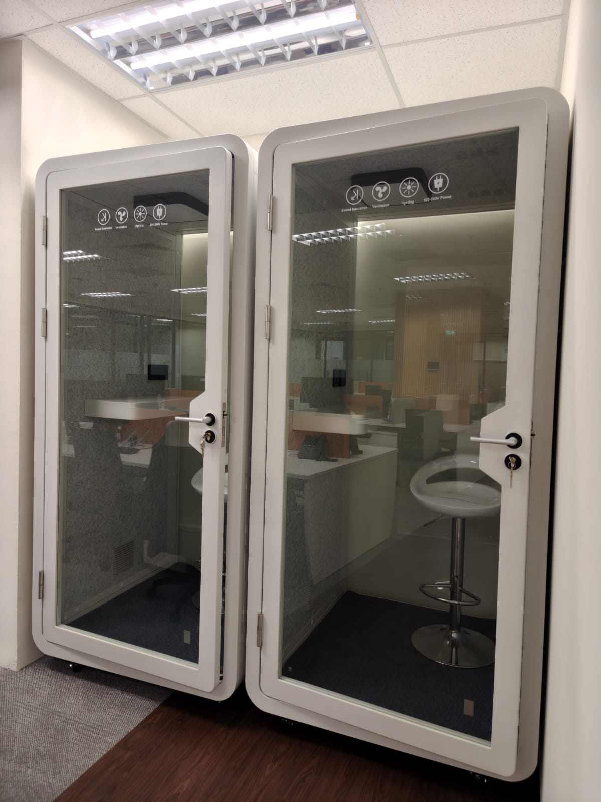 Two enclosed phone booths with glass doors, close to the desks, 78 Shenton Way, office by Metadesign Interior