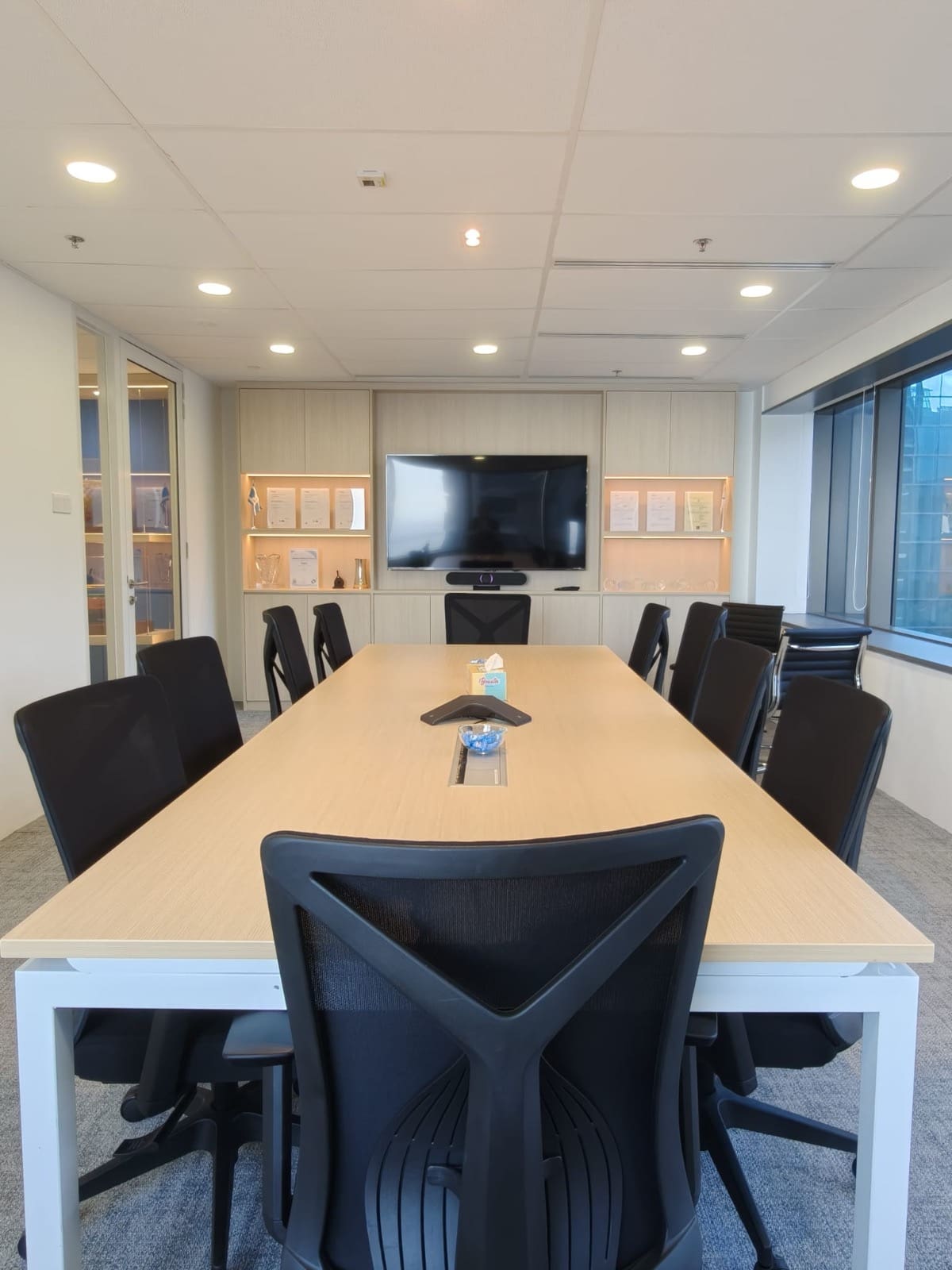 Boardroom with an oak table and a cabinet wall, OUE Downtown 1, office by Metadesign Interior
