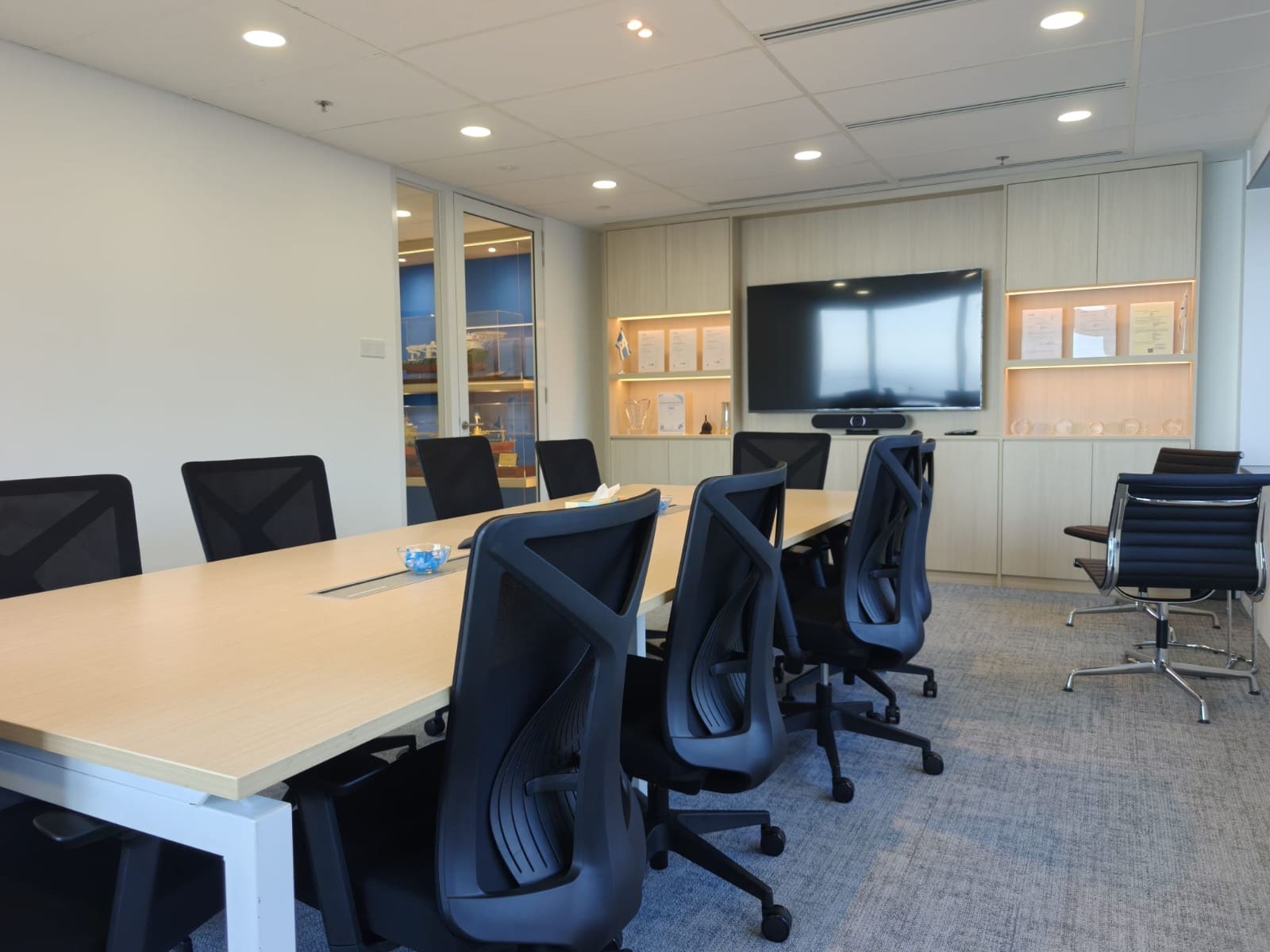 Boardroom seen from the door, with the cabinet wall and screen, OUE Downtown 1, office by Metadesign Interior
