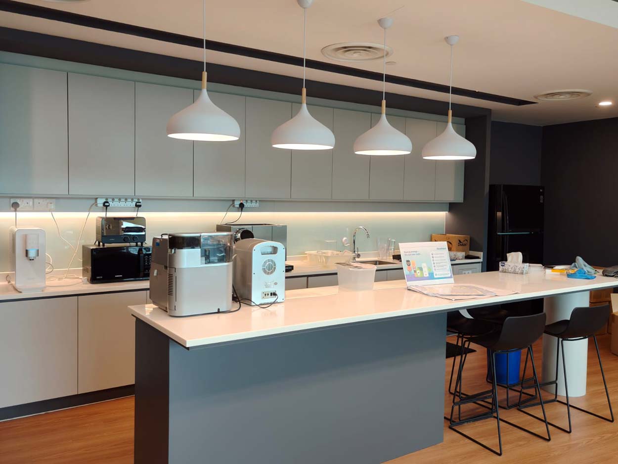 Pantry counter with pendant lights and bar stools. The Signature, AkzoNobel office.