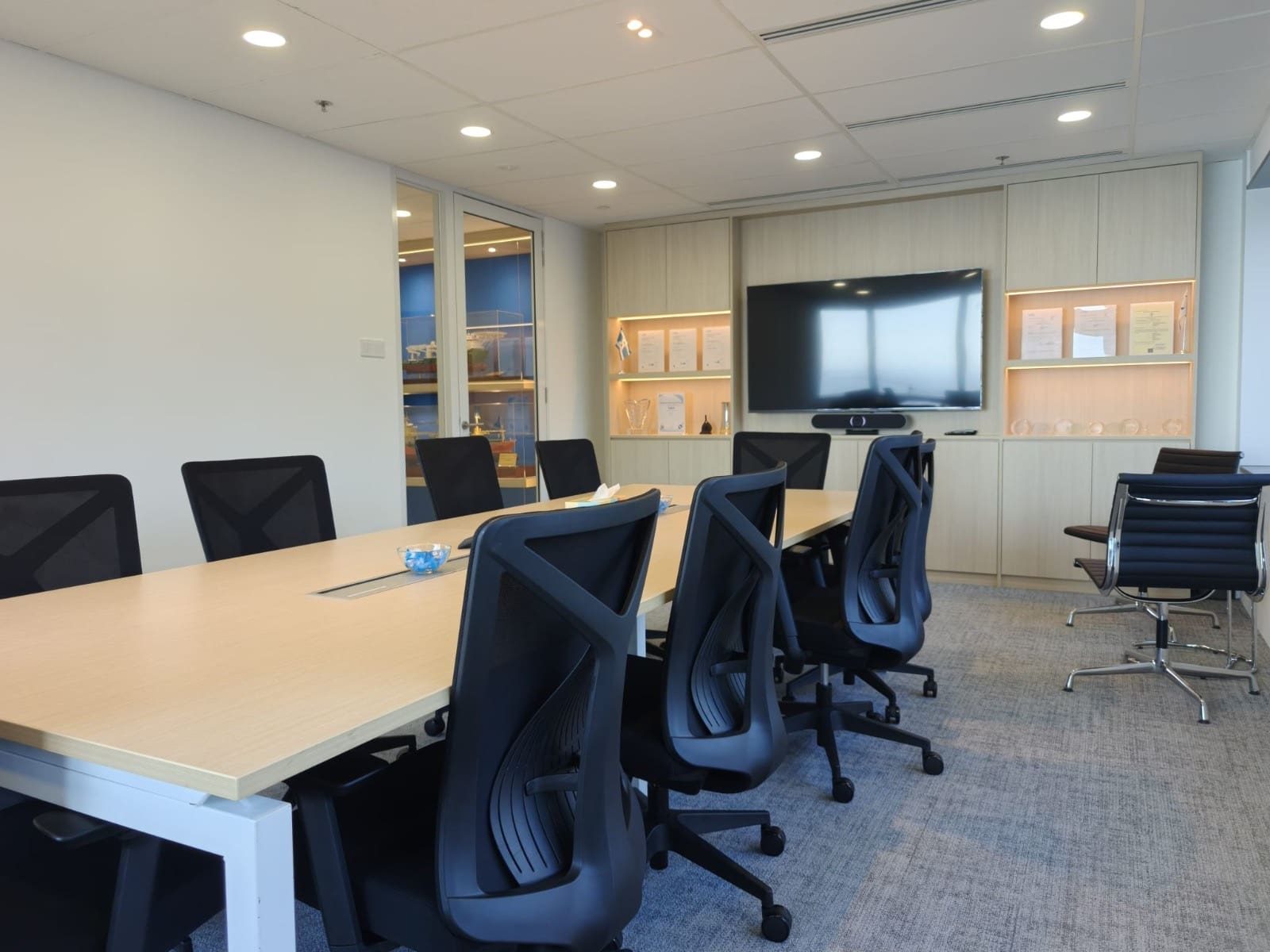 Boardroom seen from the door, with the cabinet wall and screen, OUE Downtown 1, office by Metadesign Interior