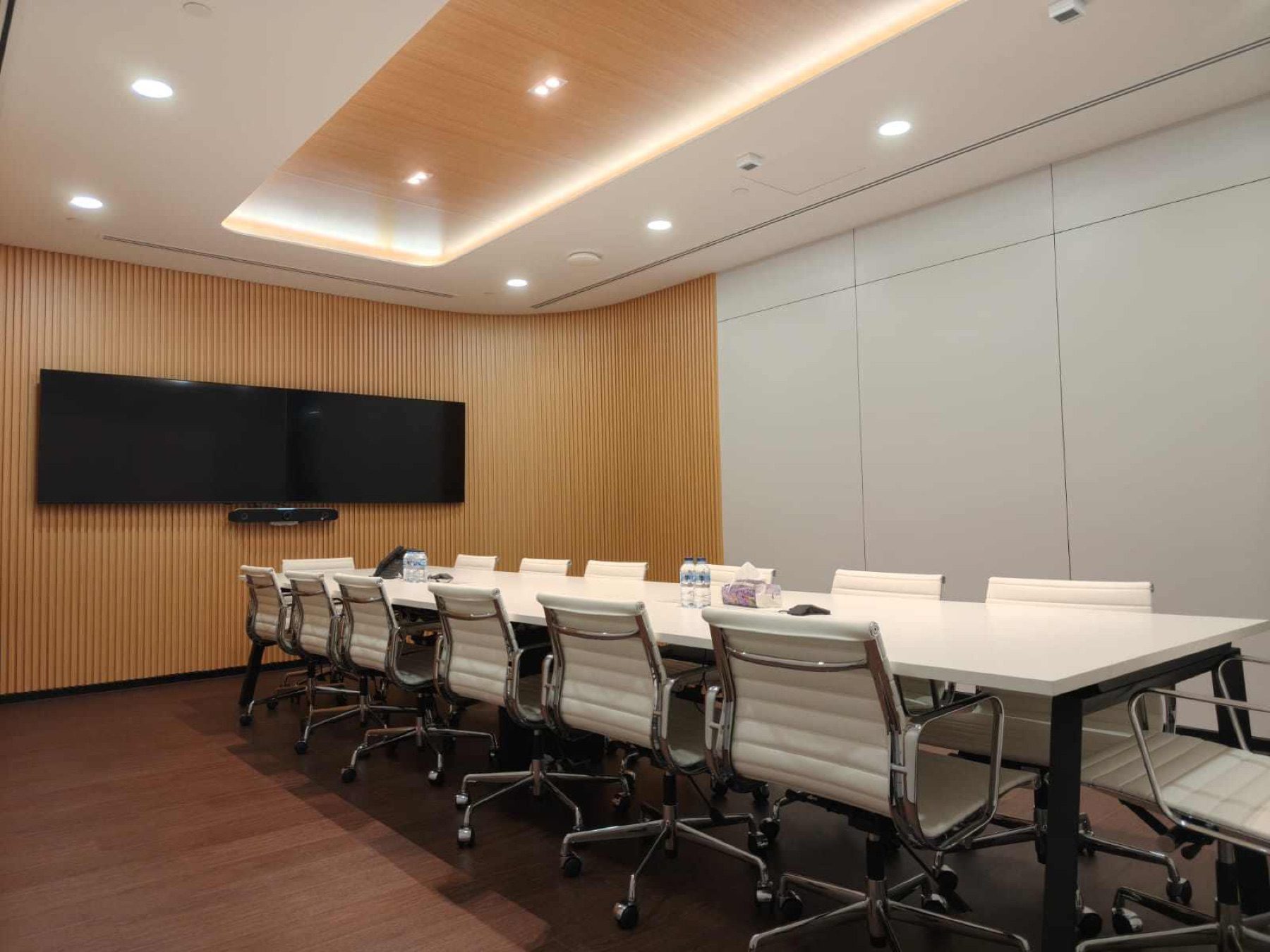 Boardroom with timber slat wall and dual screens, 78 Shenton Way, by Metadesign Interior